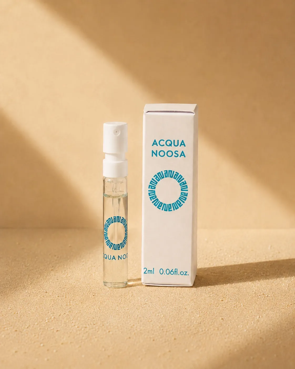 The 2ml discovery vial standing beside its slim printed box in warm sunlight
