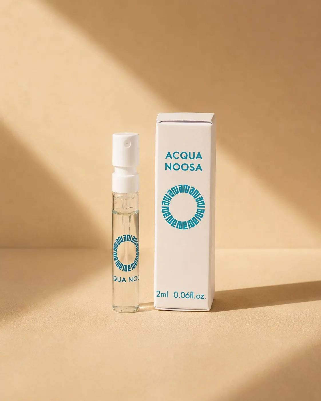 The Acqua Noosa 2ml discovery vial standing beside its box in warm light
